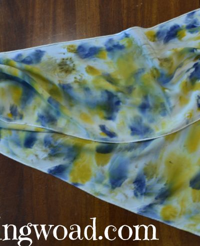 eco print scarf with hollyhock blossoms and dyer's margarite blossoms